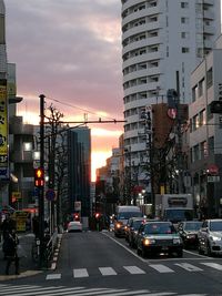 View of city street at sunset