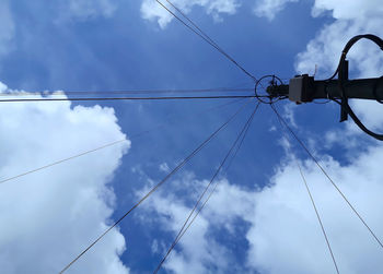 Low angle view of street light against cloudy sky