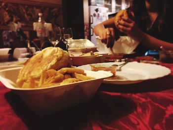 Midsection of woman eating food