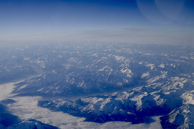 Aerial view of landscape against sky during winter