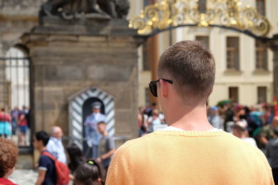 Rear view of man looking at temple