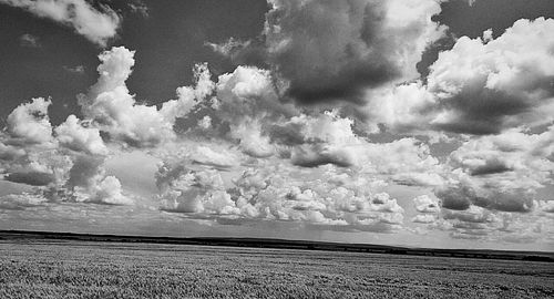 Scenic view of sea against cloudy sky