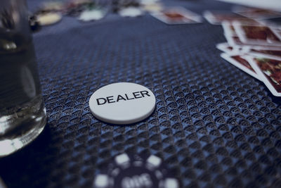 High angle view of dealer coin on table