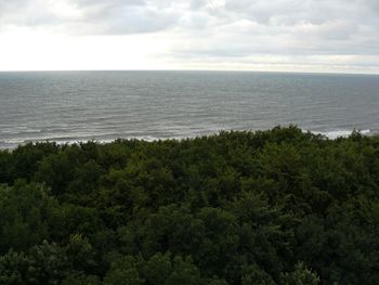 View of calm sea against cloudy sky