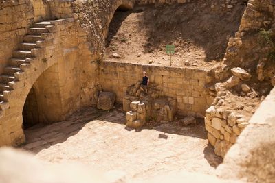 High angle view of man standing on rock