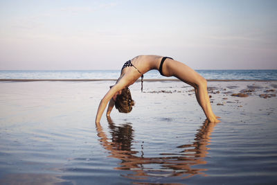 Young woman swimming in sea