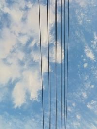 Low angle view of cables against sky