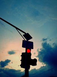 Low angle view of power lines against sky