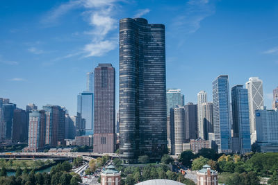 Modern buildings in city against sky