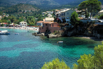 High angle view of buildings by sea