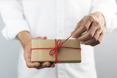 Close-up of human hand holding box