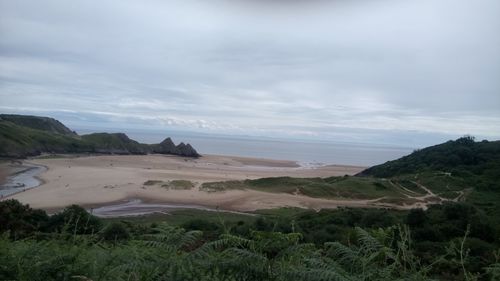 Scenic view of beach against sky