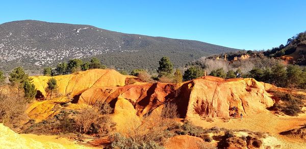 Panoramic view of rocky mountains against sky