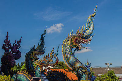 Low angle view of statue against sky