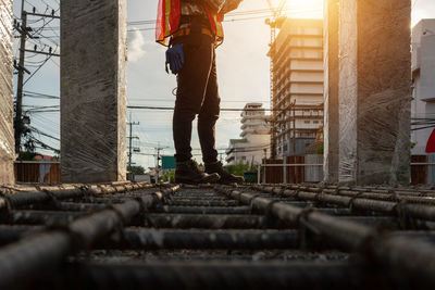 Low section of man standing in stadium