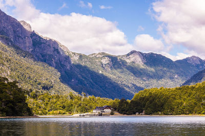 Scenic view of lake and mountains against sky