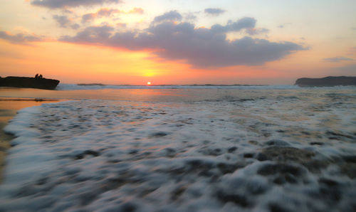 Scenic view of sea against sky during sunset