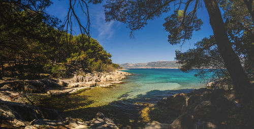 Scenic view of sea against blue sky