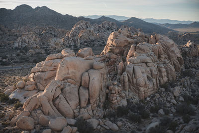 Rock formations on landscape against sky