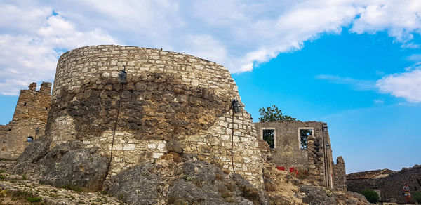 Low angle view of old building against sky