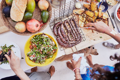 High angle view of woman preparing food on table