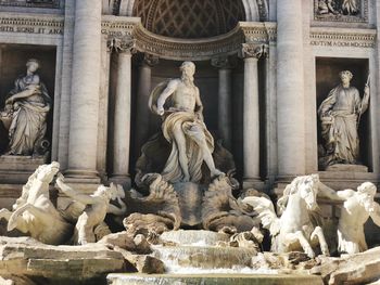 Statue in front of historic building