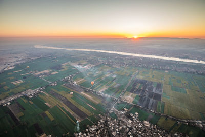 High angle view of cityscape against sky during sunset