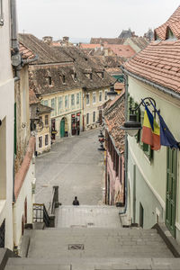 Street amidst buildings in town against clear sky