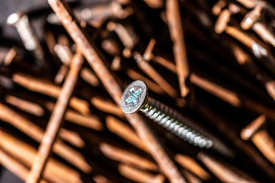Screws on top of rusty nails.