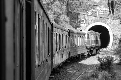 Kalka shimla toy train moving on mountain slope, beautiful view, one side mountain, one side valley