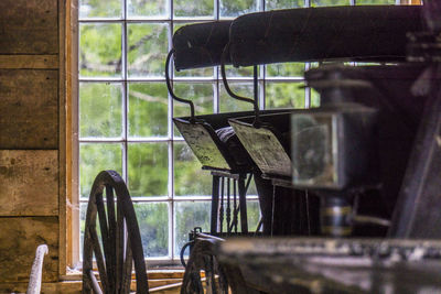 Chairs and tables in glass window