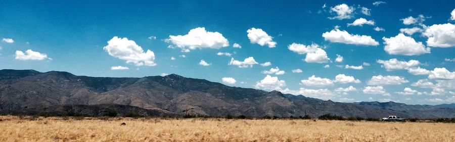 Scenic view of landscape against cloudy sky