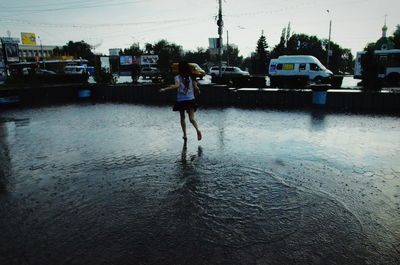 Boy standing in water