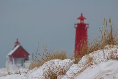 Lighthouse against sky during winter