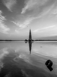 Mid distance view of kalyazin bell tower in volga river during sunset