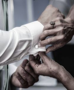 Close-up of couple holding hands