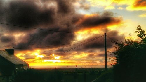 Scenic view of dramatic sky at sunset