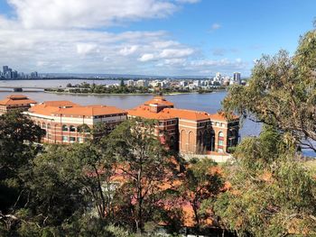 High angle view of trees and buildings against sky