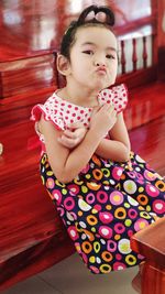 Portrait of cute girl looking away on floor