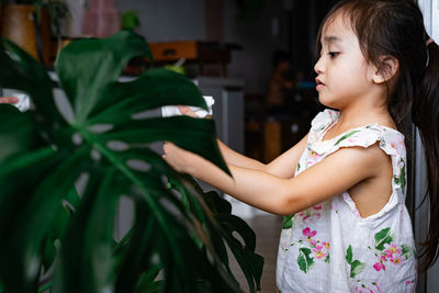 Side view of girl looking up