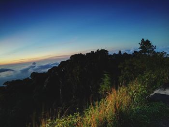 Scenic view of landscape against sky at sunset