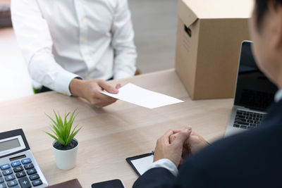Low angle view of man working on table