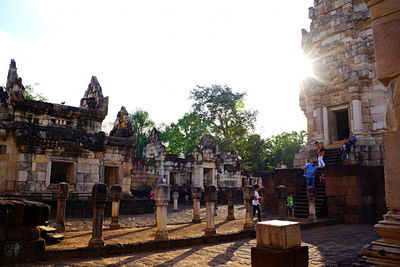 Old temple against buildings