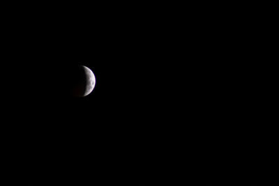 Low angle view of moon against sky at night