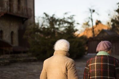 Rear view of  woman against blurred trees