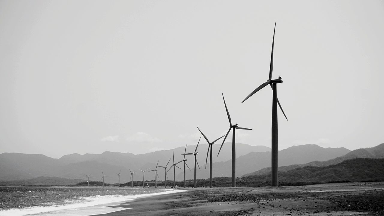 VIEW OF WIND TURBINES ON LAND