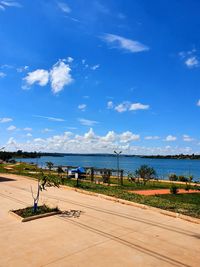 Scenic view of beach against blue sky