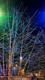 Low angle view of light trails at night