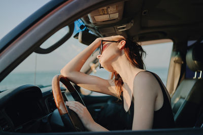 Woman sitting in car