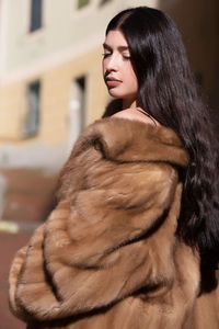 Portrait of young woman in winter